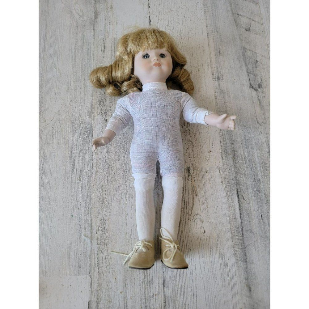 Brinn's  Vintage blonde porcelain girl doll collectible bangs‎